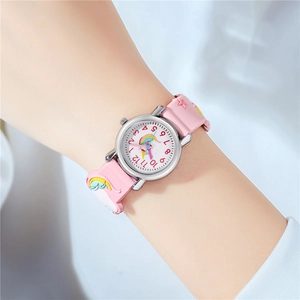 Detailed view of pink silicone watch strap with 3D unicorn and star relief for children