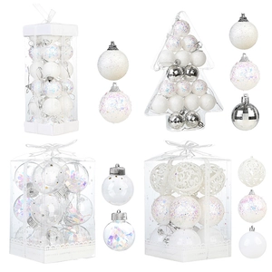 Assorted white and silver Christmas ball ornaments in decorative gift box packaging