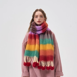 Colorful rainbow striped scarf with pom-poms and tassels made of soft plush material