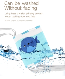 Washable baby bed cloth book with blue pufferfish design and secure white ties