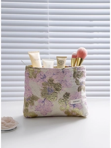 Trousse à maquillage vintage en jacquard doré avec motif floral violet élégant