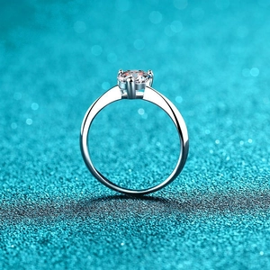 Minimalist S925 sterling silver ring with a sparkling round moissanite in 4-prong setting
