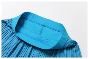 Close-up of bright blue pleated fitness skirt with seamless waist and fine accordion folds