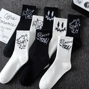 Graffiti style knit sports socks in black and white featuring street art patterns