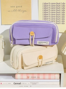 Close-up of double zipper large canvas pencil cases in purple and cream white colors
