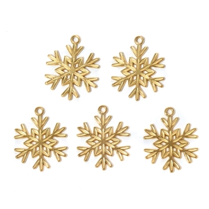 Set of five golden stainless steel snowflake charms for jewelry making on white background