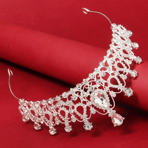 Close-up of alloy silver bridal crown with intricate vine patterns and clear rhinestones