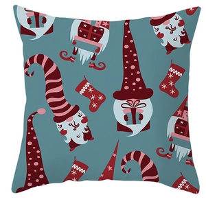 Detail of Christmas pillowcase featuring cute gnome and festive stocking print on peach skin fabric