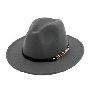 Detail view of grey wide brim fedora hat with black band and decorative gold chain