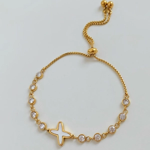Adjustable gold bracelet with white star motif and micro-pave cubic zirconia accents