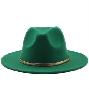 Detail view of emerald green wool fedora hat featuring a decorative gold metal chain