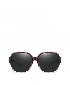 Detail view of purple frame sunglasses for women with polarized dark grey lenses