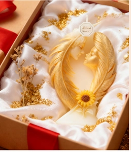Detailed relief of lover faces and feathers on creative scented candle in gift box