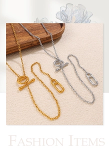 Detail of gold and silver stainless steel link necklaces with toggle clasp and oval pendant