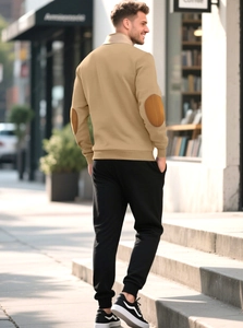 Detail of khaki pullover sweatshirt featuring contrast brown elbow patches for men