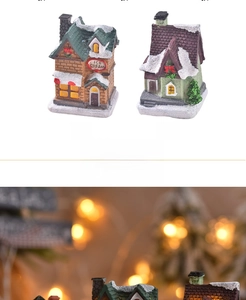 Detailed view of hand-painted resin Christmas ice cream shop with snow-covered roofs