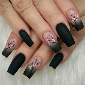 Long ballerina press-on nails with matte black, nude gradient and pink cherry blossoms