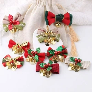 Set of Christmas festive pet bows with golden bells in plaid and solid holiday patterns