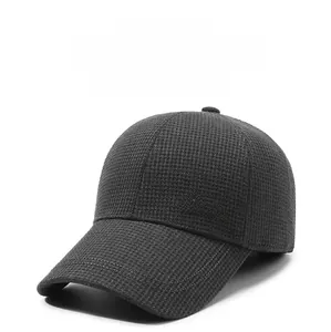 Detailed close-up of dark grey winter baseball cap featuring textured knit and Stato embroidery