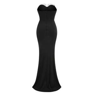 Detail of back view showing fishtail silhouette and zipper on black strapless gown