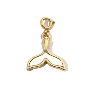 Close-up of golden whale tail pendant with white shell inlay and spring buckle