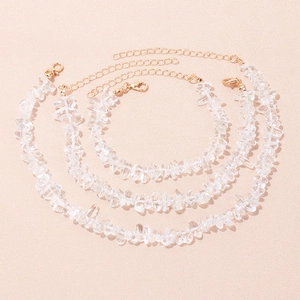 Detailed view of three natural crystal stone bracelets with gold metal chains and clasps