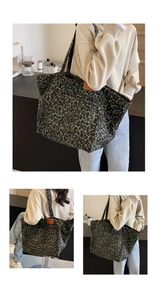 Detail view of large leopard print canvas tote bag with dark green and black patterns