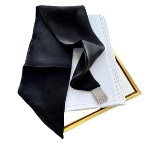 Elegant black satin triangle scarf featuring a sparkling rhinestone buckle on white background