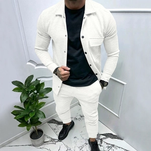 Detailed close-up of men's white waffle texture fabric on autumn casual two-piece suit set