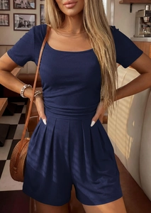 Detail of dark blue ribbed knit fabric on a stylish short sleeve casual jumpsuit
