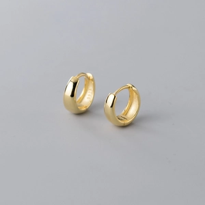 Minimalist gold S925 sterling silver hoop earrings shown in high-quality studio macro shot