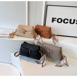 Chic textured crossbody bags in four colors featuring decorative silk heart scarves
