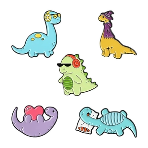 Set of five cute cartoon dinosaur enamel pins in vibrant colors and creative shapes