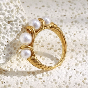 Retro 18K gold plated stainless steel ring with four faux pearls on a stone base