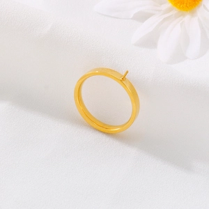 Golden DIY ring setting with pin for pearl inlay on white fabric with a daisy