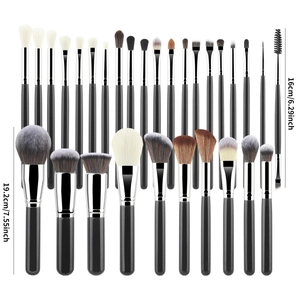 Detailed view of 30pcs professional makeup brush set with black handles and silver ferrules