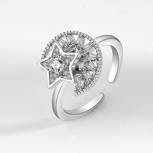 Adjustable silver rotating fidget ring with cubic zirconia moon and star design