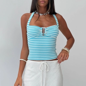 Detail of blue and white striped halter top featuring a front ring buckle and knit texture