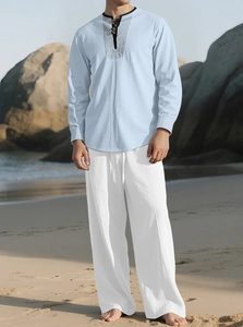 Men's light blue Henley shirt and white linen pants set for casual beach vacations