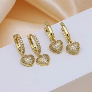 Elegant 18k gold plated heart hoop earrings with zircon stones on silk background