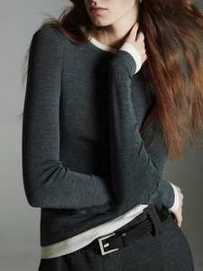 Slim fit dark grey wool knit top with white contrast trim and long sleeves for women