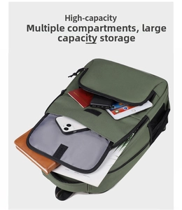 Detail view of large capacity dark green backpack showing organized internal compartments