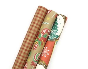 Three rolls of vintage Christmas wrapping paper with candy and plaid patterns on white
