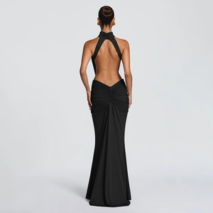 Rear view of elegant backless black evening gown with ruched detail and fishtail hem
