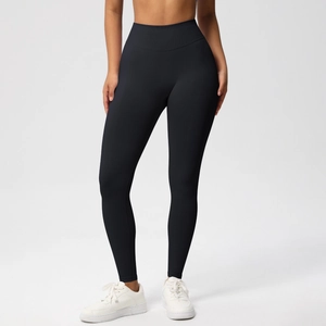Detail of high-waist black yoga leggings featuring tummy control and seamless compression