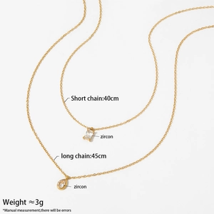 Double-layered stainless steel necklace with square and teardrop zircon pendants in gold finish