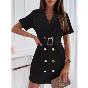 Detail view of double-breasted black blazer dress with a gold buckle waist belt