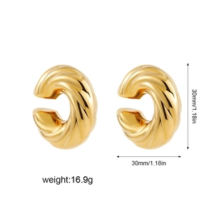 Macro detail of 30mm thick twisted hollow hoop earrings in 18k gold polished stainless steel