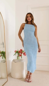Detail of light blue bodycon dress showing textured fabric and backless design