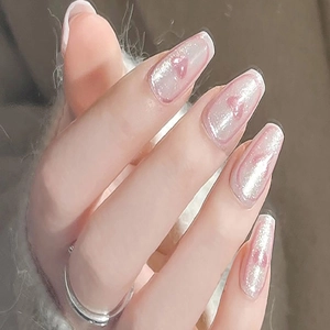 Cat eye glitter press-on nails with pink heart patterns and long coffin shape